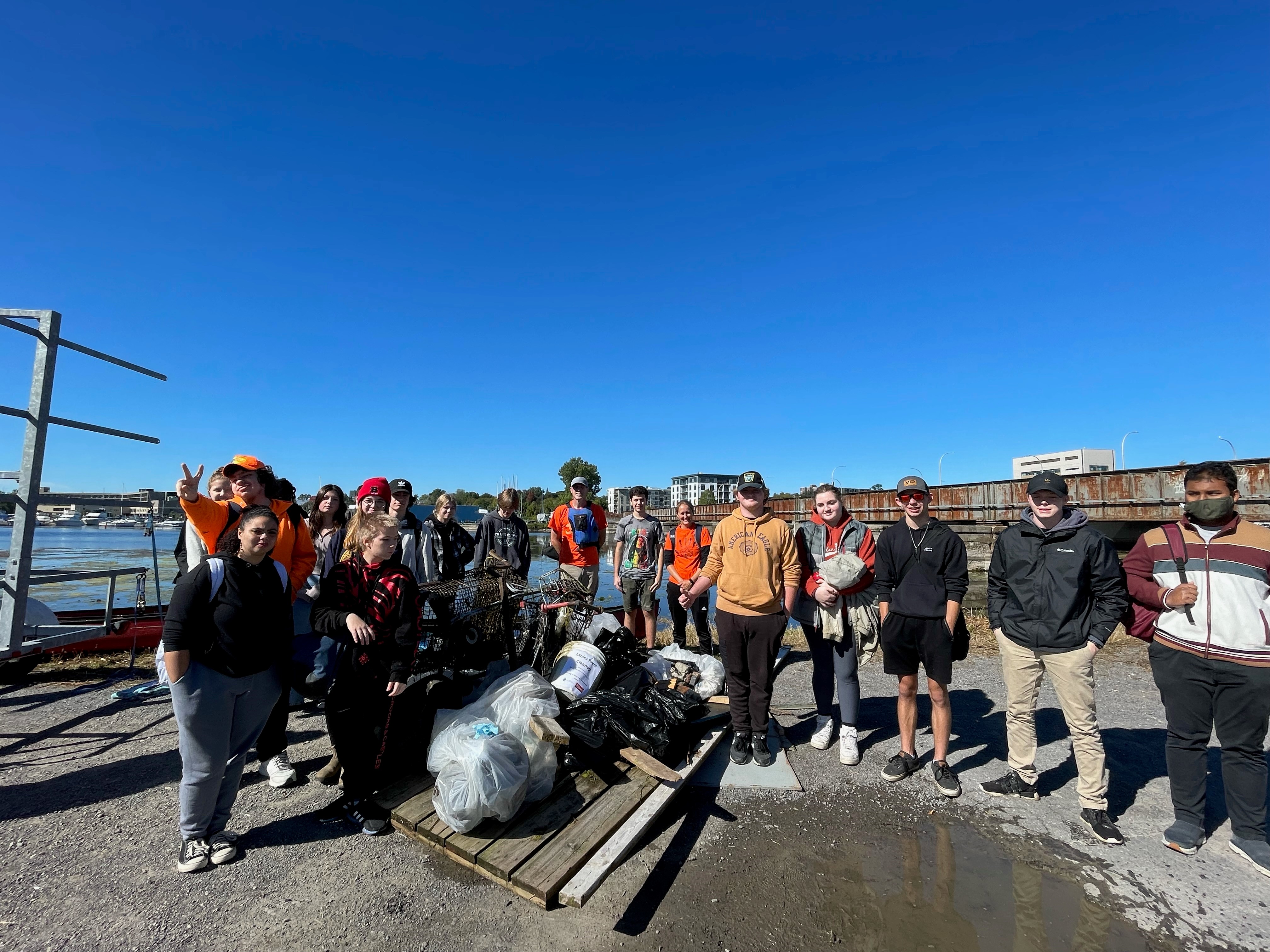 A group of students with the garbage they cleaned up